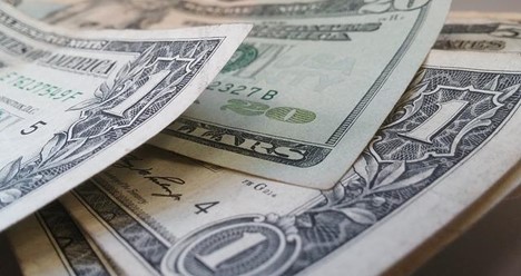 Dollar notes representing forex profits from scalping strategy